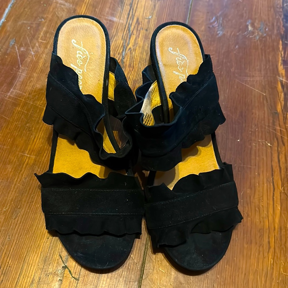 Ruffle black suede heel sandal that can dress up or down.Really cute Free People